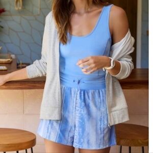 Travis Mathew Women's Dawn Glow Sleeveless Golf Romper in cornflower blue.size L